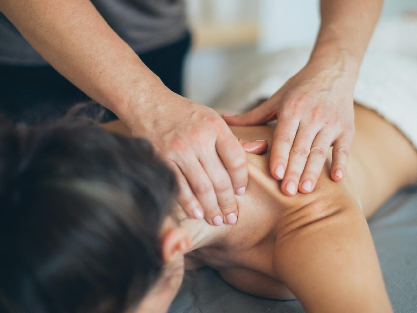 A soothing massage therapy session focused on relaxation and wellness indoors.
